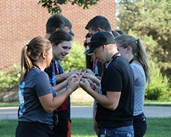 Teens participating in a team building exercise